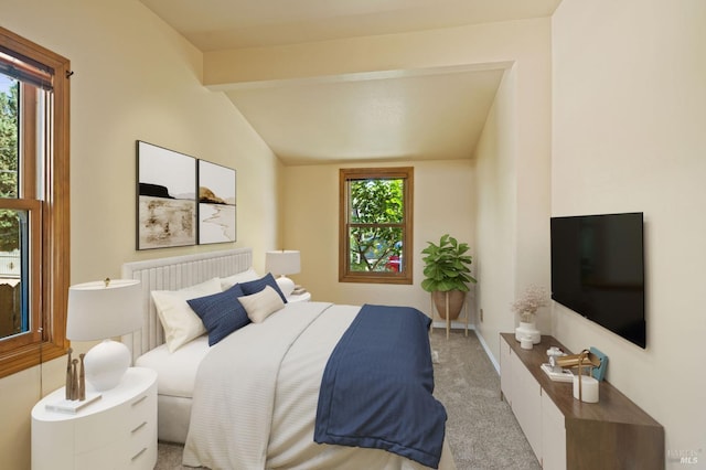 bedroom featuring multiple windows, lofted ceiling with beams, and carpet