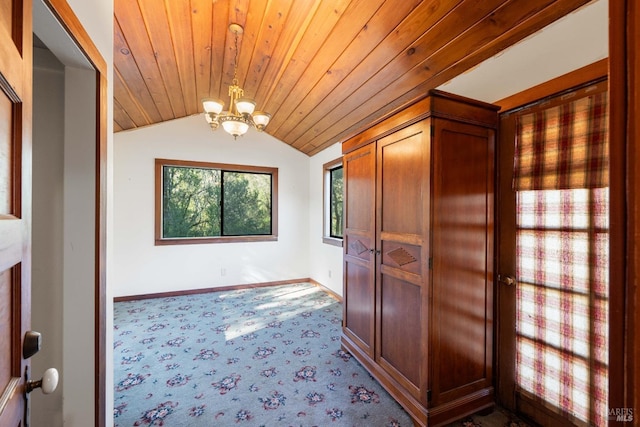 hall with vaulted ceiling, wood ceiling, and an inviting chandelier