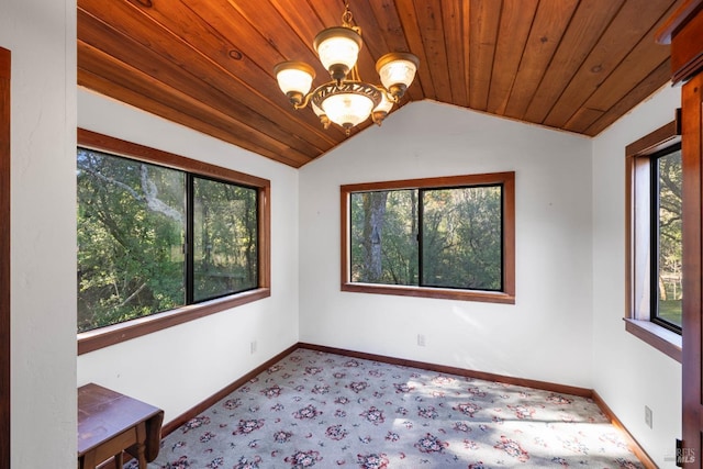 interior space with a chandelier, plenty of natural light, wooden ceiling, and lofted ceiling