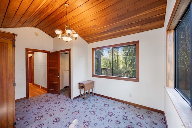 unfurnished bedroom with wood ceiling, light colored carpet, a notable chandelier, and lofted ceiling