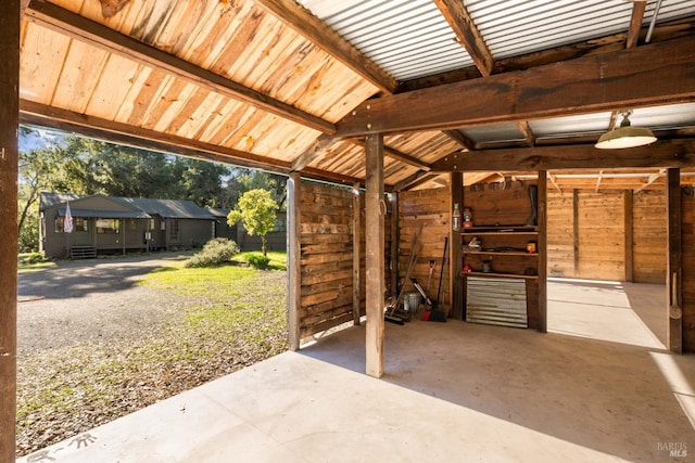 view of patio featuring an outbuilding