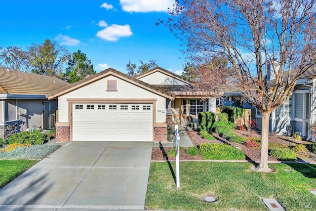 ranch-style home with a garage and a front lawn