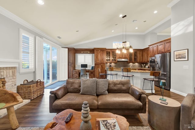 living room featuring dark wood-type flooring, vaulted ceiling, and ornamental molding