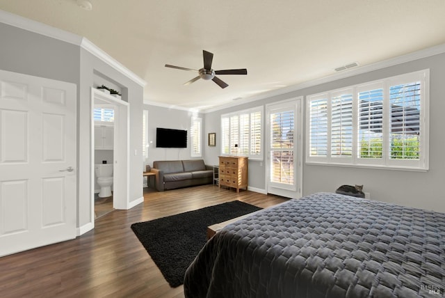 bedroom featuring crown molding, ceiling fan, connected bathroom, and dark hardwood / wood-style flooring