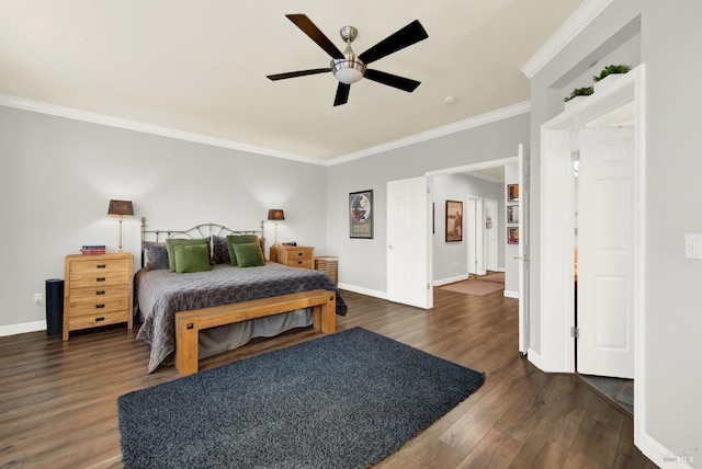 bedroom featuring crown molding, dark wood-type flooring, and ceiling fan