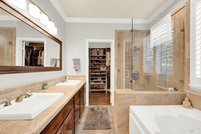 bathroom featuring shower with separate bathtub, ornamental molding, and vanity