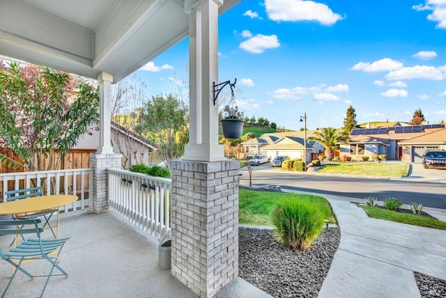 view of patio featuring a porch