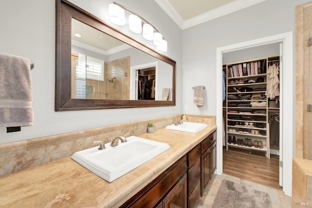 bathroom featuring ornamental molding, vanity, tile patterned floors, and walk in shower