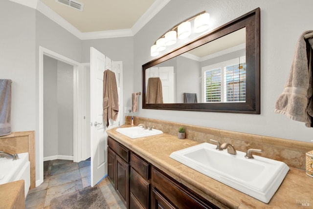 bathroom featuring crown molding and vanity