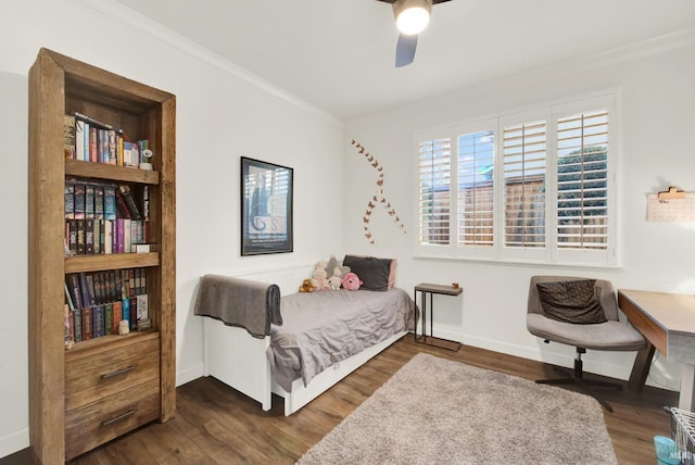 bedroom with ornamental molding, dark hardwood / wood-style floors, and ceiling fan