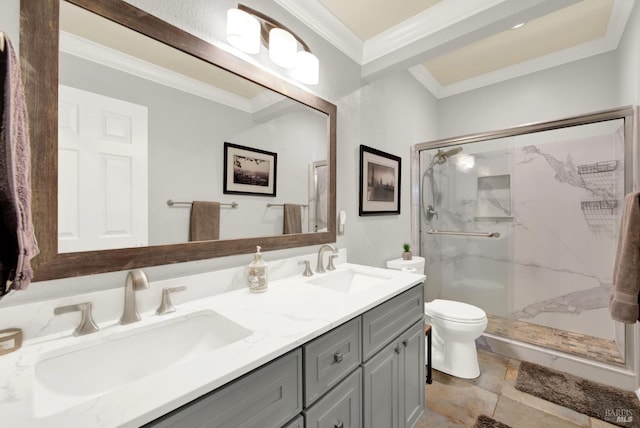 bathroom with vanity, ornamental molding, toilet, and walk in shower