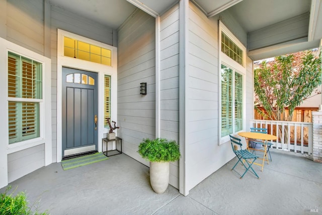 property entrance with covered porch