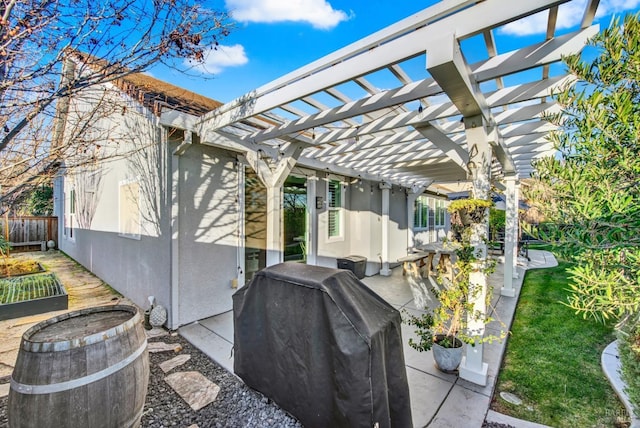 view of patio / terrace with area for grilling and a pergola