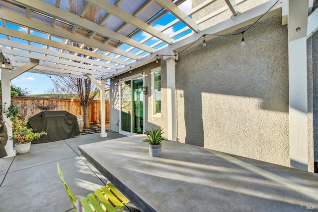 view of patio / terrace with a pergola and grilling area