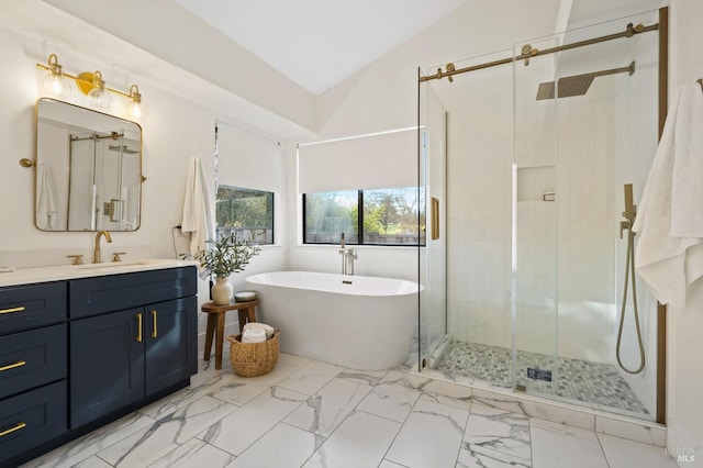 bathroom with lofted ceiling, vanity, and independent shower and bath