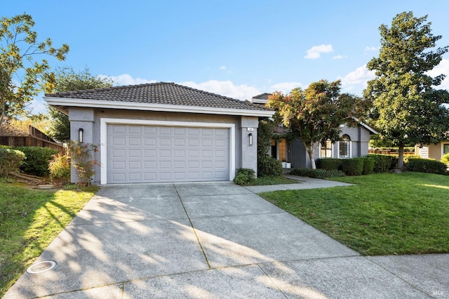 view of front of home featuring a garage and a front yard