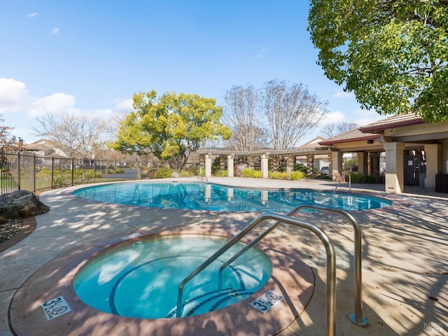 view of pool featuring a hot tub