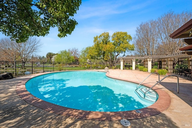 view of pool with a patio area and a pergola