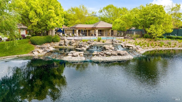 rear view of property featuring a water view