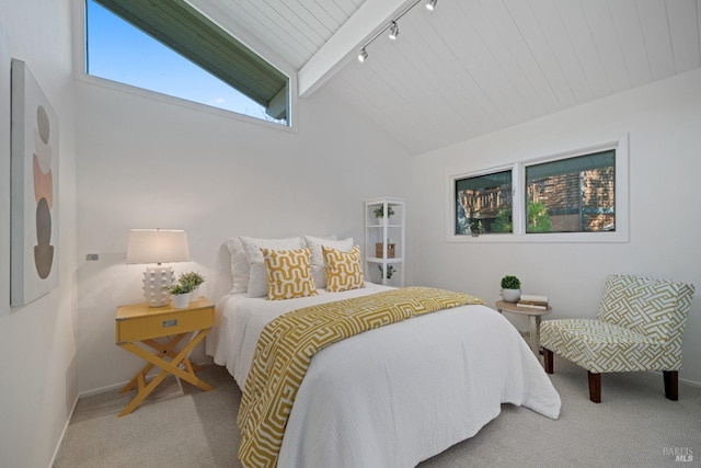 bedroom featuring carpet floors, beam ceiling, and high vaulted ceiling