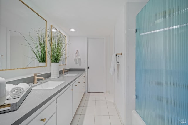 bathroom with tile patterned floors and vanity