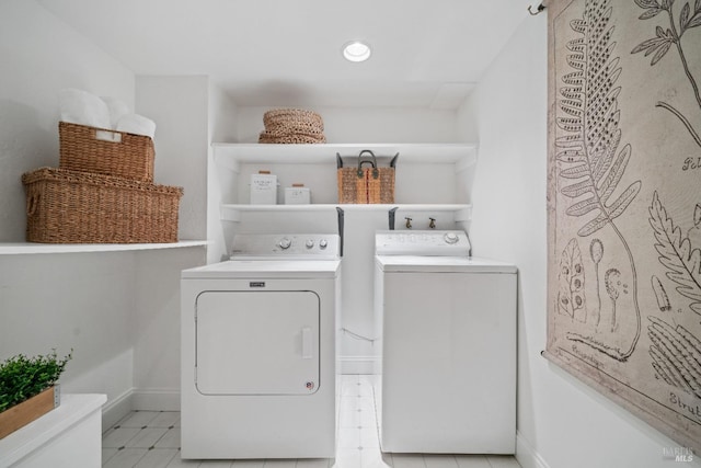 clothes washing area featuring washing machine and dryer