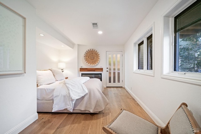 bedroom with light hardwood / wood-style flooring