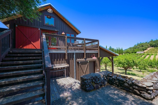 back of property featuring a wooden deck