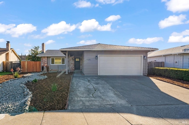 ranch-style home featuring a garage