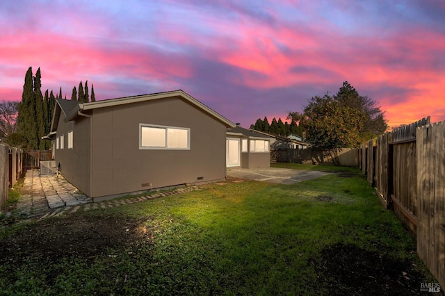 exterior space featuring a yard and a patio area