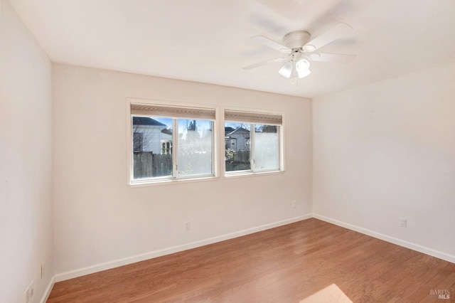 unfurnished room featuring ceiling fan and wood-type flooring