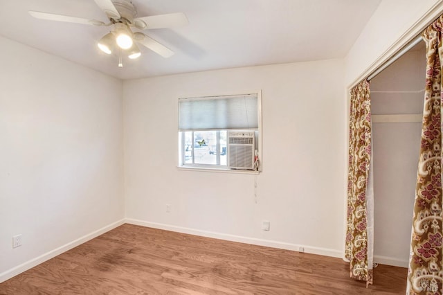 spare room featuring ceiling fan and hardwood / wood-style floors