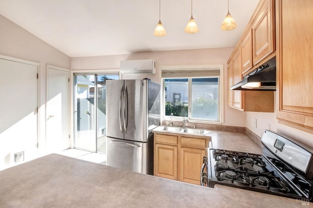 kitchen featuring appliances with stainless steel finishes, sink, decorative light fixtures, vaulted ceiling, and light brown cabinets