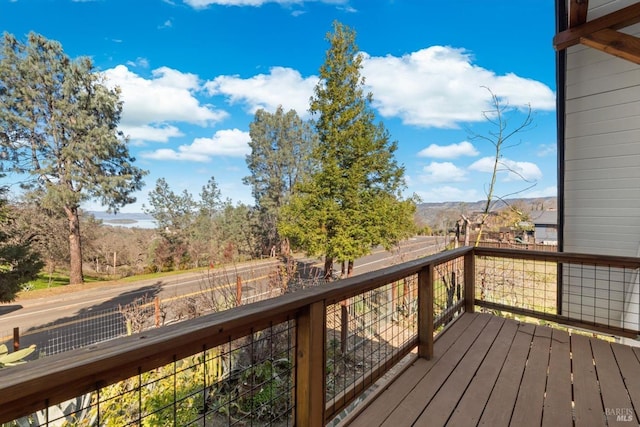 wooden deck with a mountain view