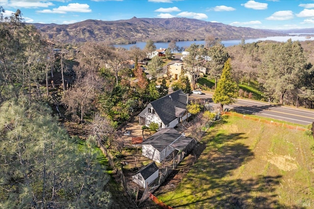 drone / aerial view featuring a water and mountain view