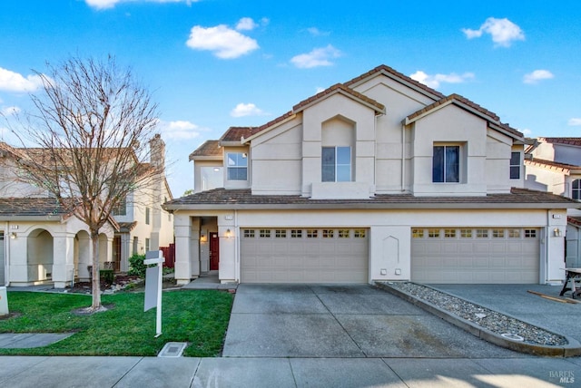 view of front of house featuring a garage and a front yard