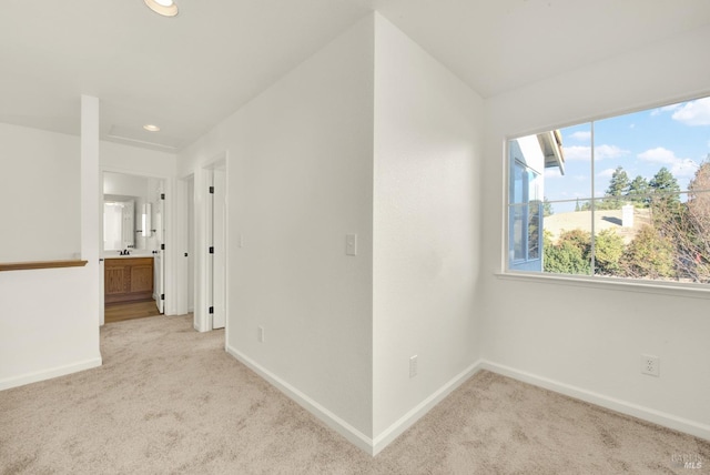 carpeted spare room with baseboards and recessed lighting