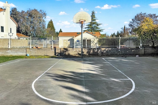 view of sport court featuring community basketball court and fence