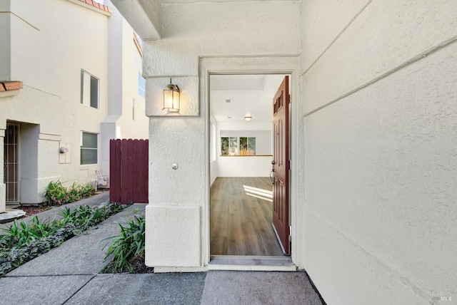 doorway to property with stucco siding