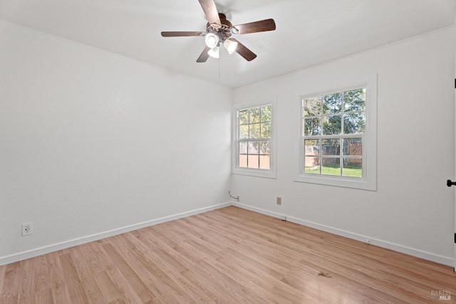 spare room featuring ceiling fan and light wood-type flooring