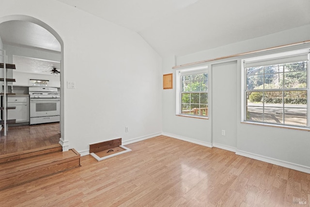 interior space featuring lofted ceiling, ceiling fan, and light wood-type flooring