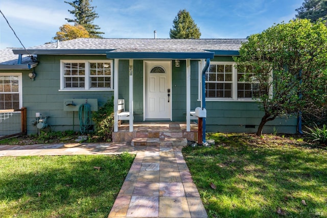 ranch-style home with a front lawn