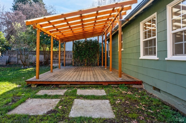 deck featuring a yard and a pergola