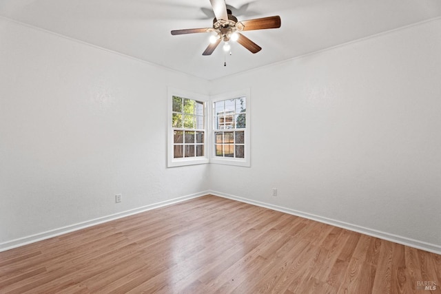 unfurnished room featuring ceiling fan, crown molding, and light hardwood / wood-style floors