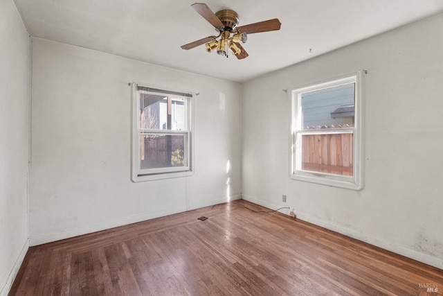 empty room featuring ceiling fan and wood-type flooring