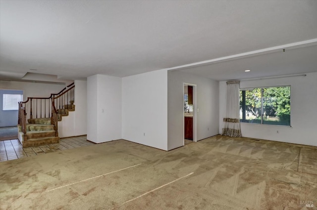 empty room featuring light carpet