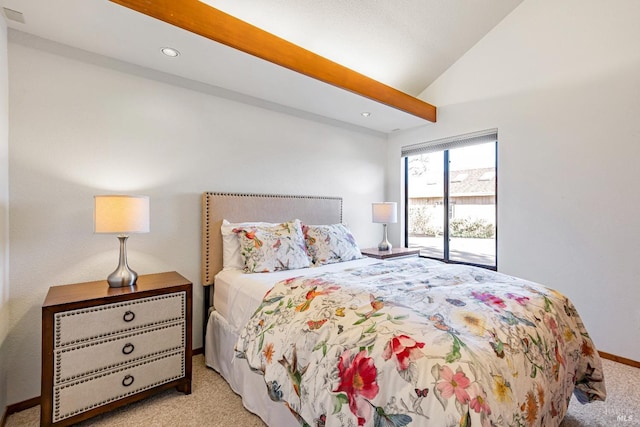 carpeted bedroom with lofted ceiling and baseboards