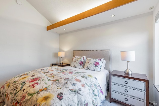 bedroom with lofted ceiling and carpet