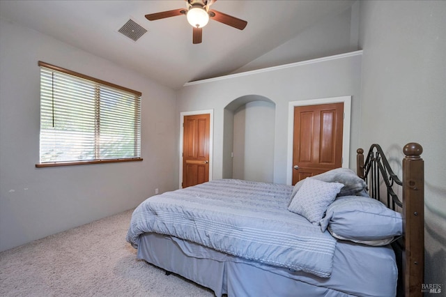 carpeted bedroom featuring ceiling fan and vaulted ceiling