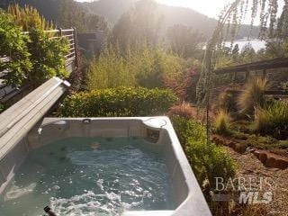 view of pool featuring a hot tub